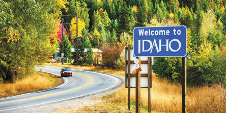 A sign denoting the border of Montana welcoming travelers to the state of Idaho.