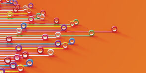 Bar graph made of colorful duct tapes on orange background. Data visualization concept.