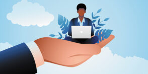 Giant hand holding a businessman who works on a laptop