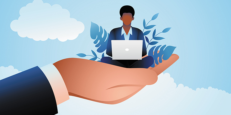 Giant hand holding a businessman who works on a laptop