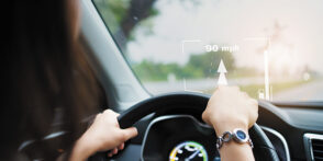 Woman driving with HUD in windshield